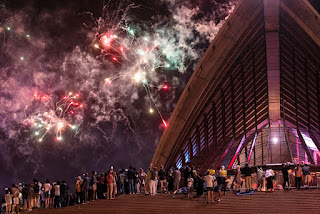 The world welcomes 2022 with muted celebrations as COVID-19 cases surge